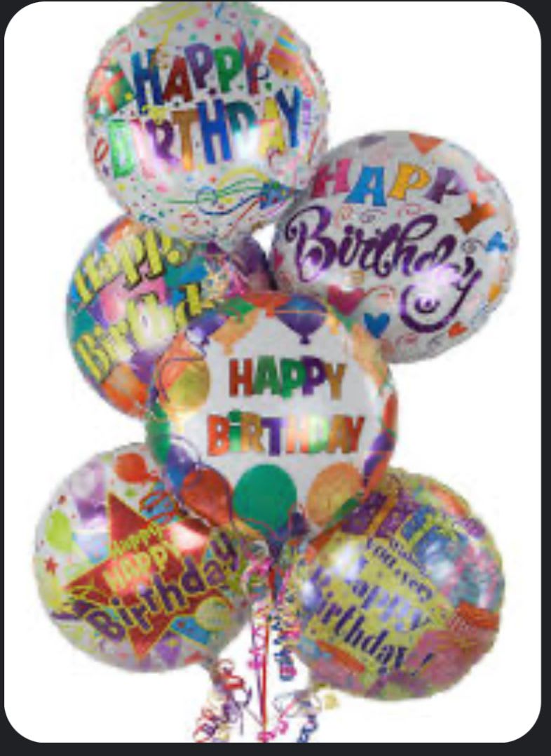 Cluster of colorful birthday balloons with printed messages
