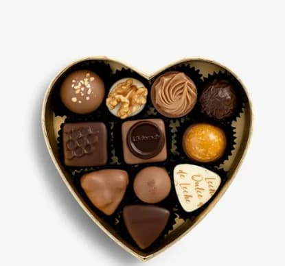 Heart-shaped box of assorted chocolates on a white background
