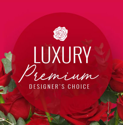 Red roses with a "Luxury Premium Designer's Choice" label