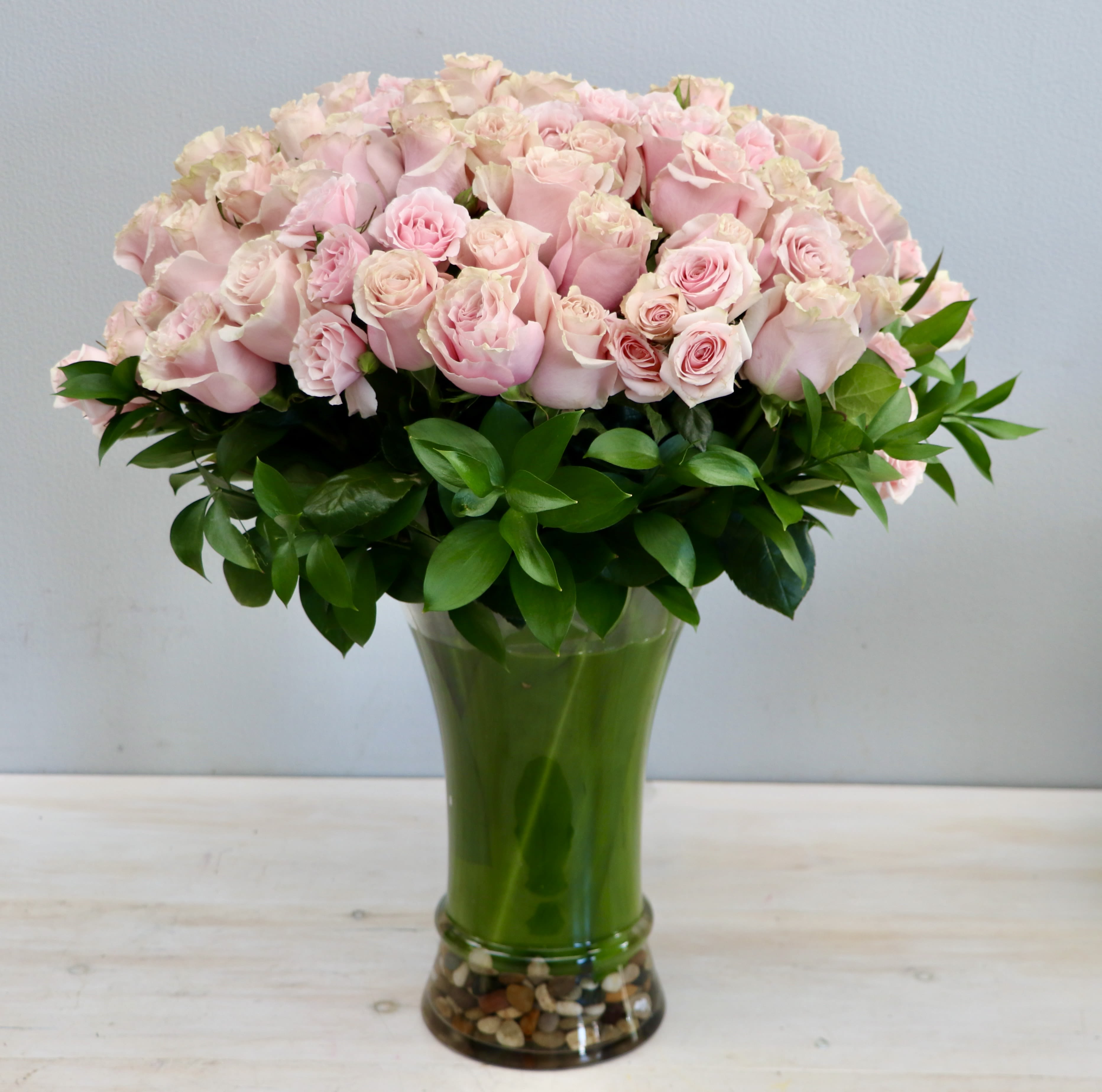 Oh Roses! - Glendale Florist - 100 premium long stem roses. This grand arrangement stands taller than 28'' and 24'' wide. Make sure to upgrade to deluxe or premium for even more roses!  Photo featured is PREMIUM version. 