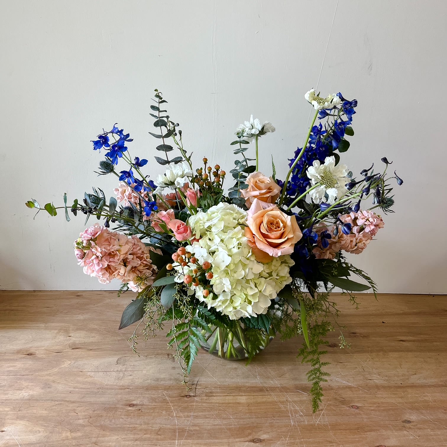 Summer Breeze - A Fresh Color Palette of Peach, Blues and white blooms looks elegant in our 8in bubble bowl.