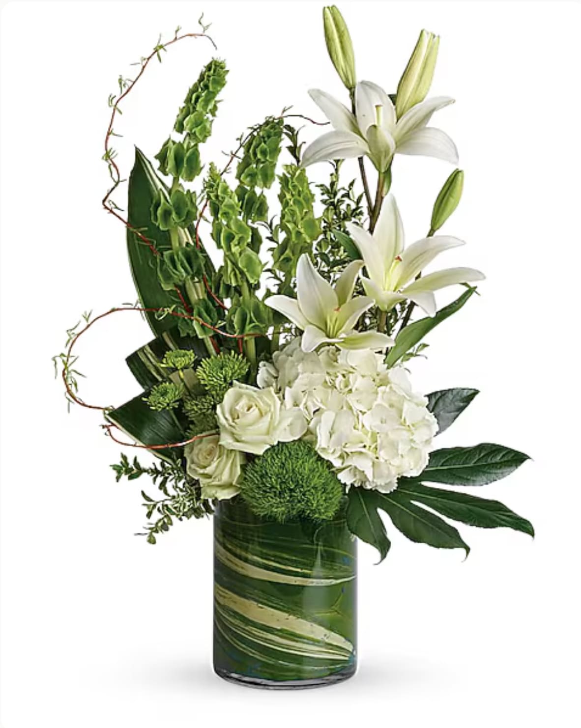White lilies and roses arranged in a tall green glass vase