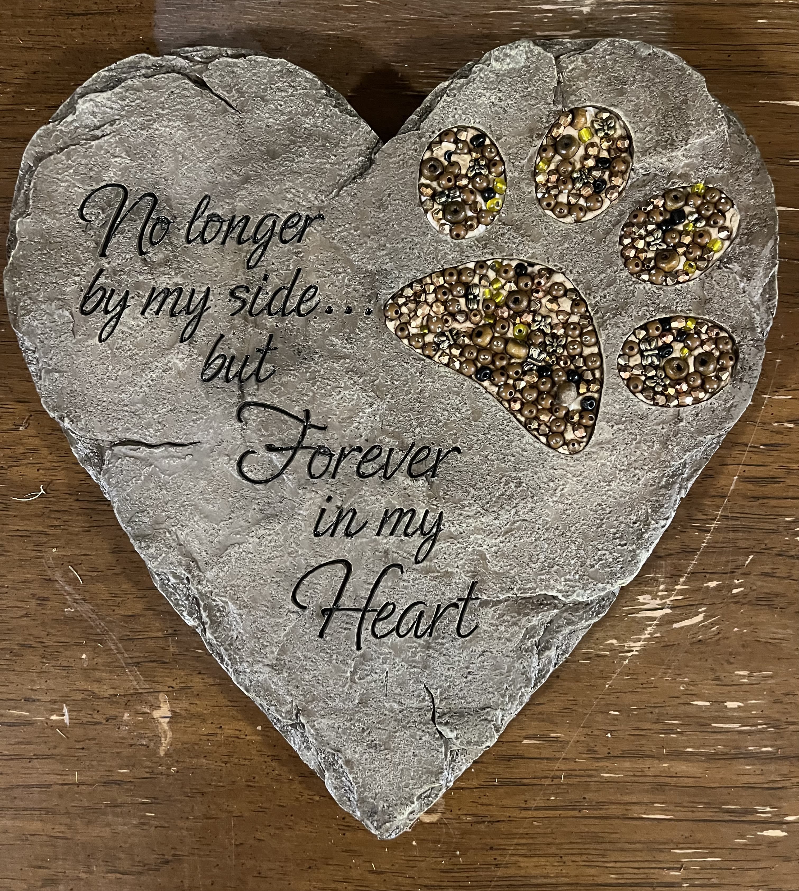 Heart-shaped memorial plaque with paw prints and the words "Forever in my Heart"