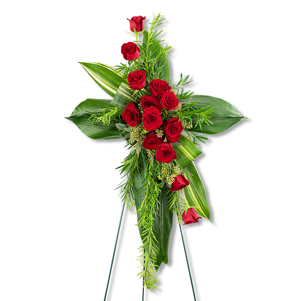 Standing floral cross with red roses and green foliage