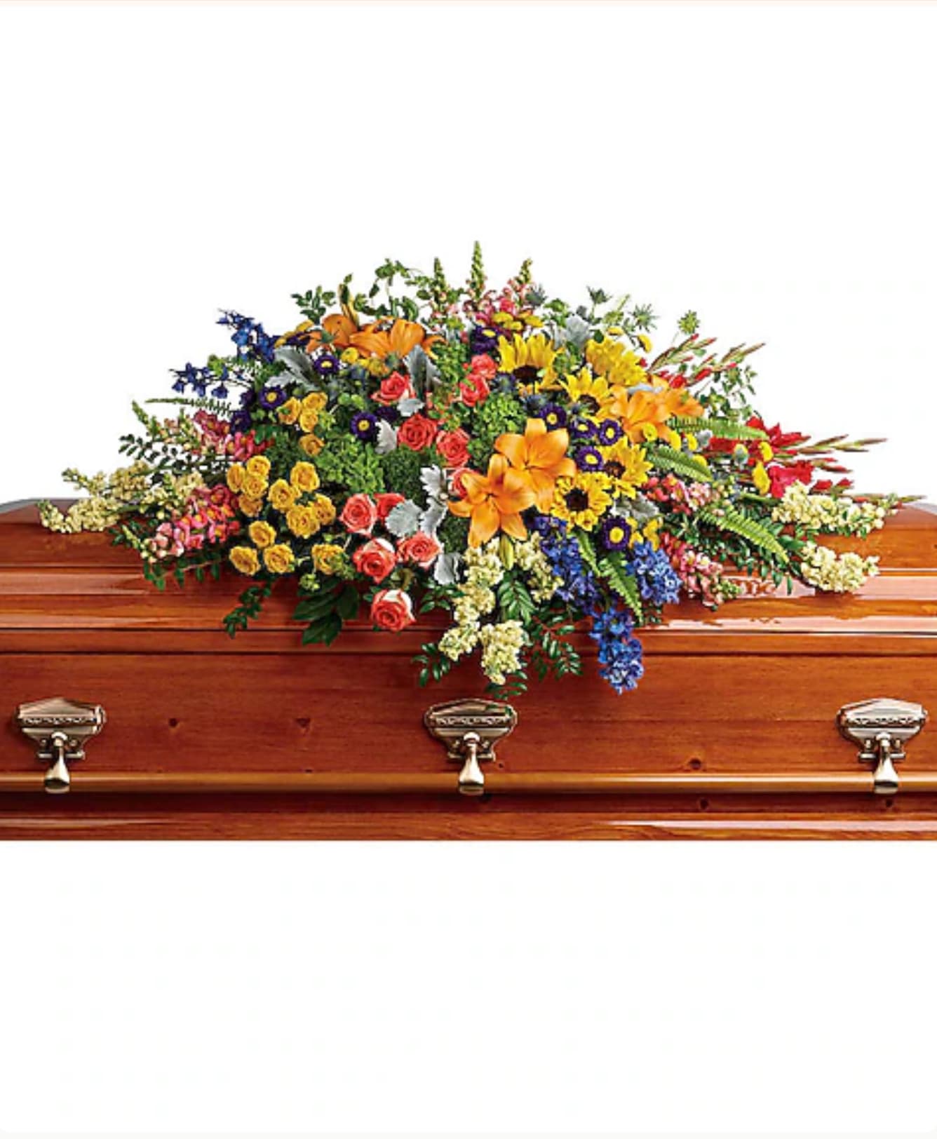 Colorful floral casket spray with mixed blooms on a wooden coffin