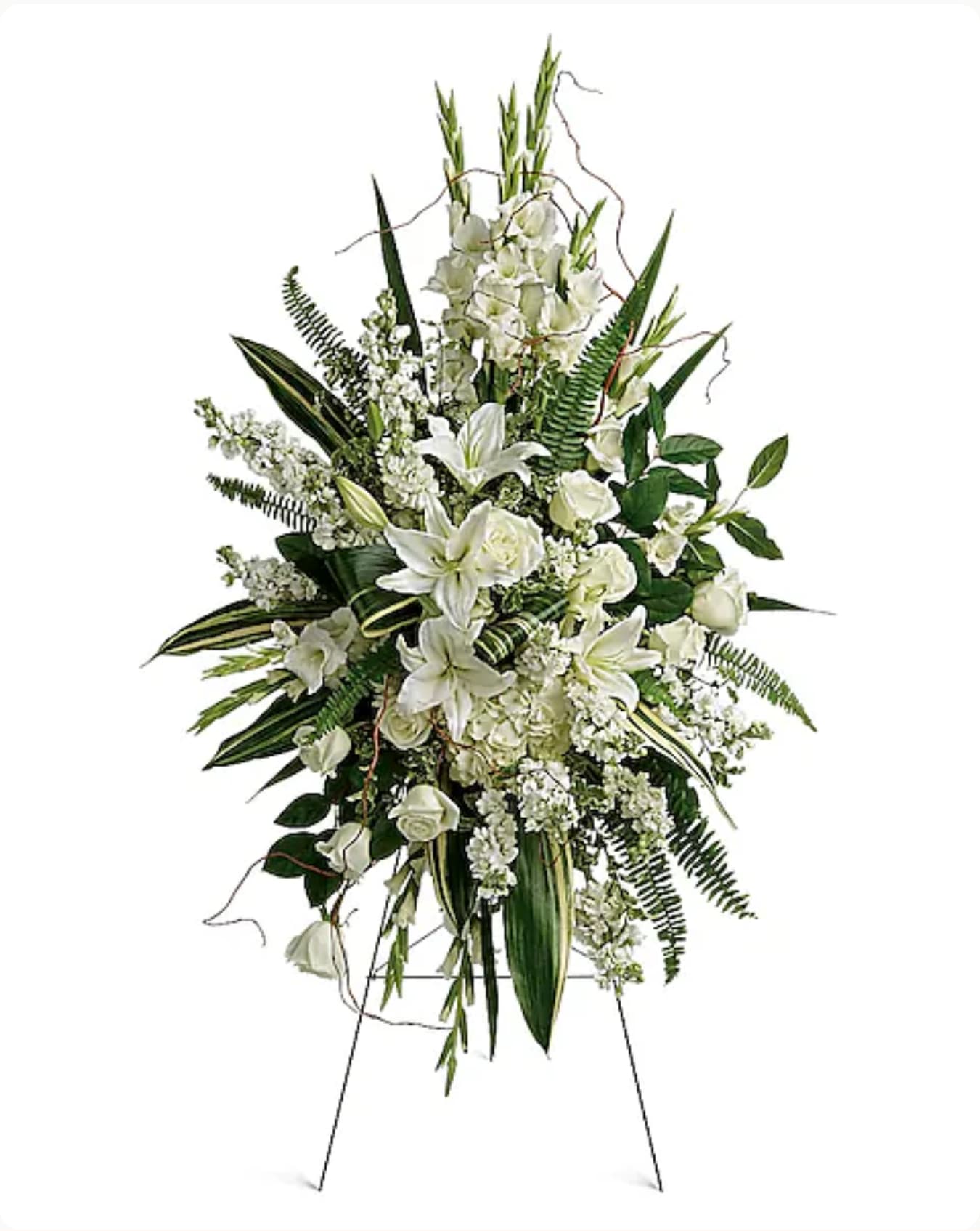 Tall white floral standing spray with lilies and roses on an easel