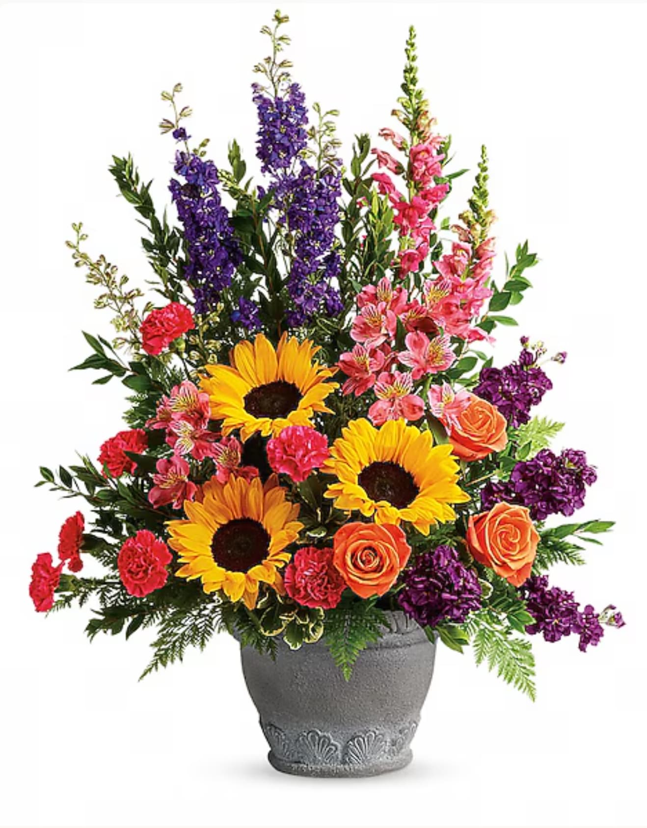 Colorful bouquet with sunflowers, roses, and purple blooms in a gray vase