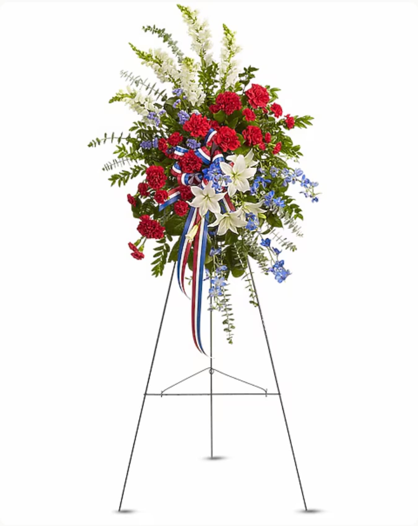 Standing floral spray with red, white, and blue flowers on an easel