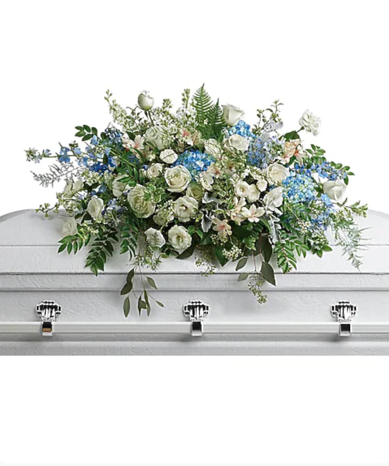 White and blue floral casket spray with greenery