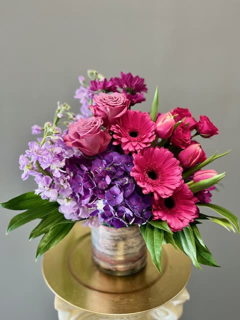 Pink and purple bouquet in a glass vase