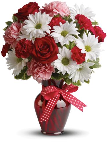 Red roses and white daisies in a red vase with a polka-dot ribbon