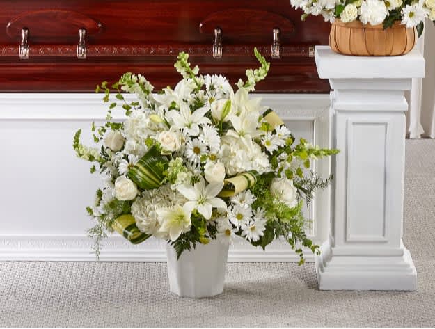 Thoughts of Tranquility Floor Basket - Comfort, beauty and grace come together in this stunning display of serene blooms. Our Thoughts of Tranquility Floor Basket is handcrafted by a local florist with ivory roses and white hydrangea, snapdragons and lilies to show how much you care.  The Deluxe Bouquet is approximately 32"H x 32"W.
