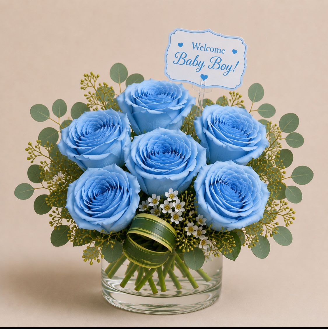 Little Star - Soft pastels and a cheerful "It's a Boy!" balloon make this Little Star flower arrangement an unmistakable new-baby gift that feels both celebratory and gently comforting. Designed as a baby shower or Welcome Baby bouquet, the mix of lavender, blue, purple, pink, white, and green reads as joyful and serene-exactly the impression the new parents (or the new little one) will receive.  A low, rounded composition sits in your choice of a woven basket or a clear glass vase, densely packed with white Asiatic lilies, lavender roses, pale pink daisy-like blooms, blue roses or iris accents, purple filler flowers, and soft eucalyptus-like greenery. The design includes a foil balloon and a small decorative sign that announce the occasion, plus a green ribbon for a finishing touch; the compact size keeps the arrangement easy to display on tabletops or a hospital bedside.   Little Star also works beyond newborn celebrations-it's a thoughtful housewarming or "just because" surprise, a gentle sympathy or I'm Sorry gesture, and a bright pick for Best Friends Day, Boss's Day, or Admin Professionals' Week. For a new baby, graduation, or Memorial Day remembrance, this arrangement arrives ready to display and enjoy; simple care-fresh water in the vase or regular misting in the basket-will help blooms stay lovely through the week.