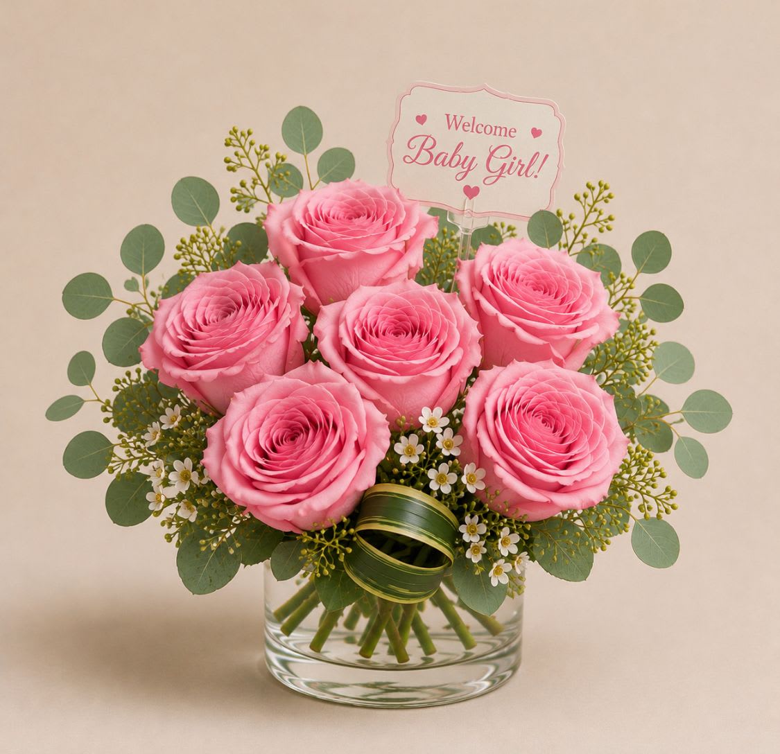  Cherish  - Soft pink lilies and five rosy pink roses are the first thing she'll notice - a cheerful baby-gift bouquet that reads "It's a Girl!" and makes a newborn's room feel celebrated. This flower arrangement for a new baby pairs pink, white and lavender blooms with green accents, and also works as a gentle sympathy or funeral tribute when a softer, more hopeful message is called for.  Roses, carnations, daisies, alstroemeria and lilies are arranged compactly in a clean white container or clear glass vase (depending on selection), accented with airy green foliage, small white filler flowers, a green ribbon and a decorative "It's a Girl!" foil balloon and pick sign. The tabletop scale keeps the presentation neat and giftable, with a prominent pink lily at the front and five clustered pink roses creating a warm focal point.  Perfect for welcoming a daughter, sending comfort, or marking a quiet remembrance, this bouquet arrives ready to display and bring a gentle, uplifting presence to hospital rooms, home nurseries, or memorial gatherings. Care: keep blooms in fresh water, trim stems and replace water every 2-3 days to extend vase life.