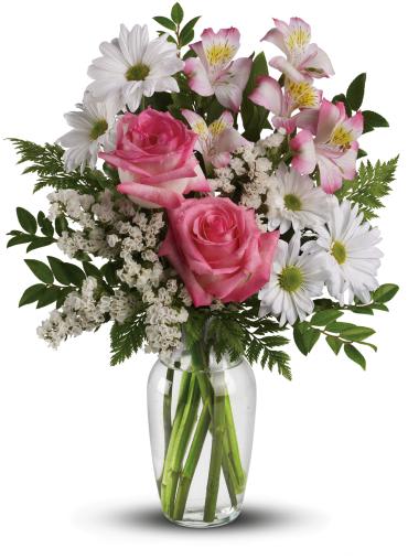 What a Treat Bouquet with Roses -   This charming bouquet is called "What a Treat" because that's what it is. A sparkling clear glass vase overflowing with pink roses, pink alstroemeria, white mums and white statice - what could be "treatier?" Treat someone special.  This beautiful bouquet incudes pink roses, pink alstroemeria, white daisy spray chrysanthemums and white statice accented with assorted greenery. 