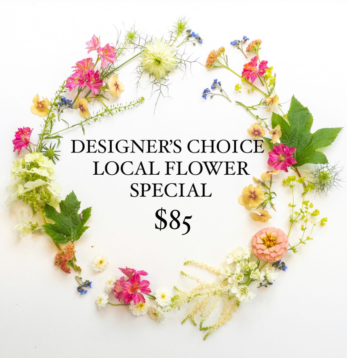Assorted small pink, yellow, and white flowers arranged in a loose circular frame around text on white background
