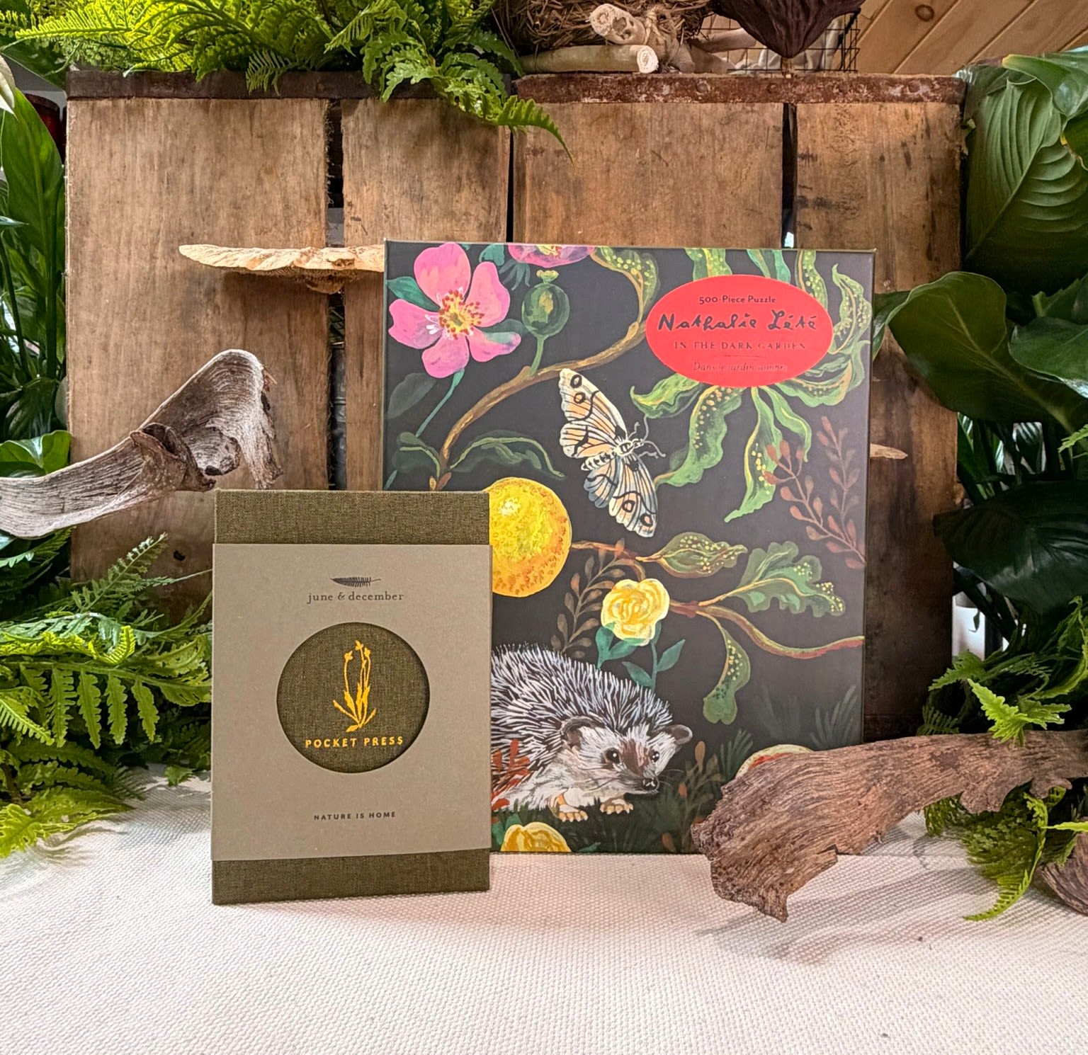 Botanist Gift Set - Perfect for the flower and plant lover in your life. This gift set includes a beautiful 500 piece puzzle with illustrations by artist Natalie Lete, and a linen covered pocket flower press with gold foil details.