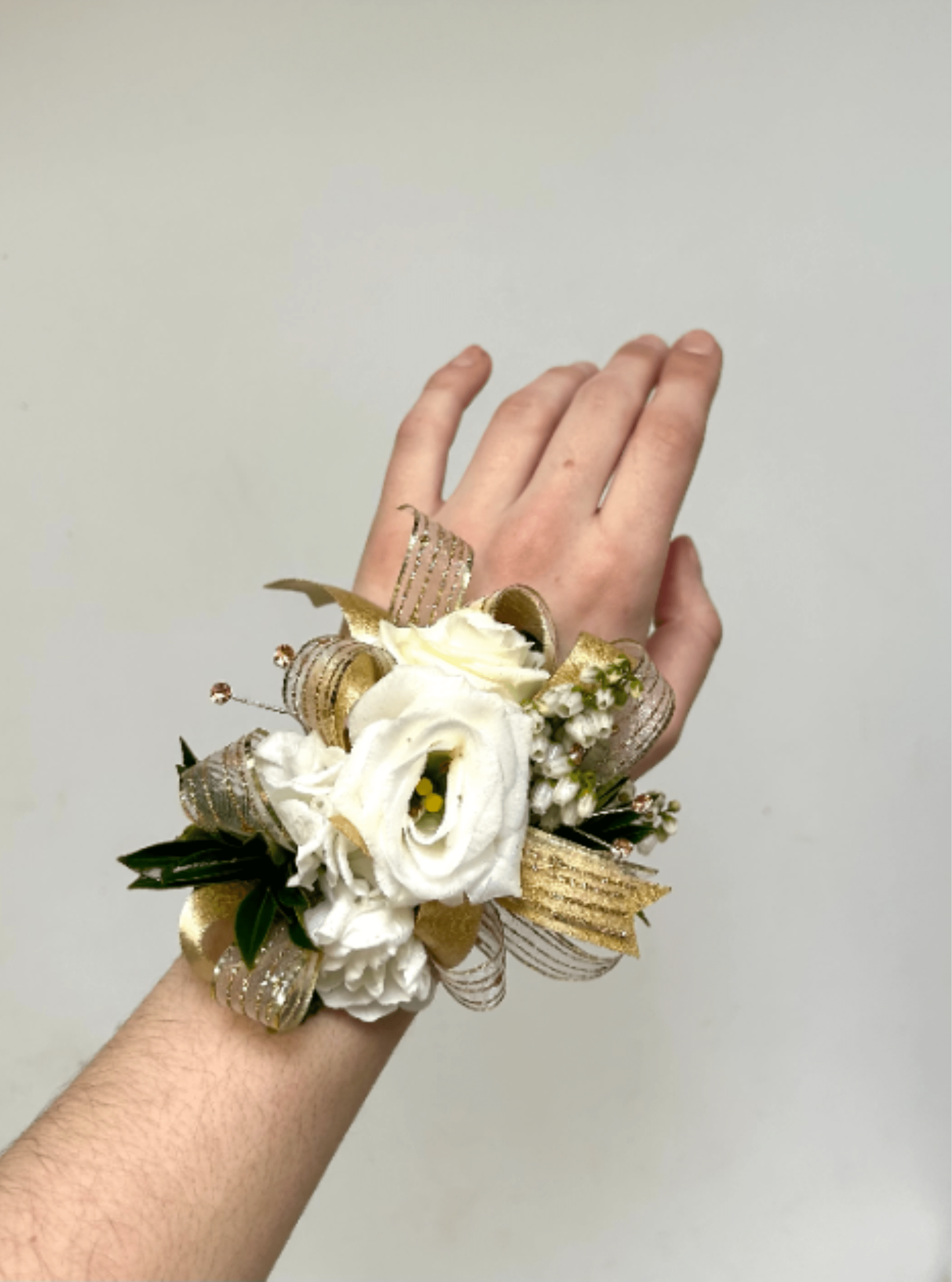 White &amp; Gold Mixed Wrist Corsage - White and gold wrist corsage. For specific flowers, please comment in special instructions and we will try our best to accomodate. 