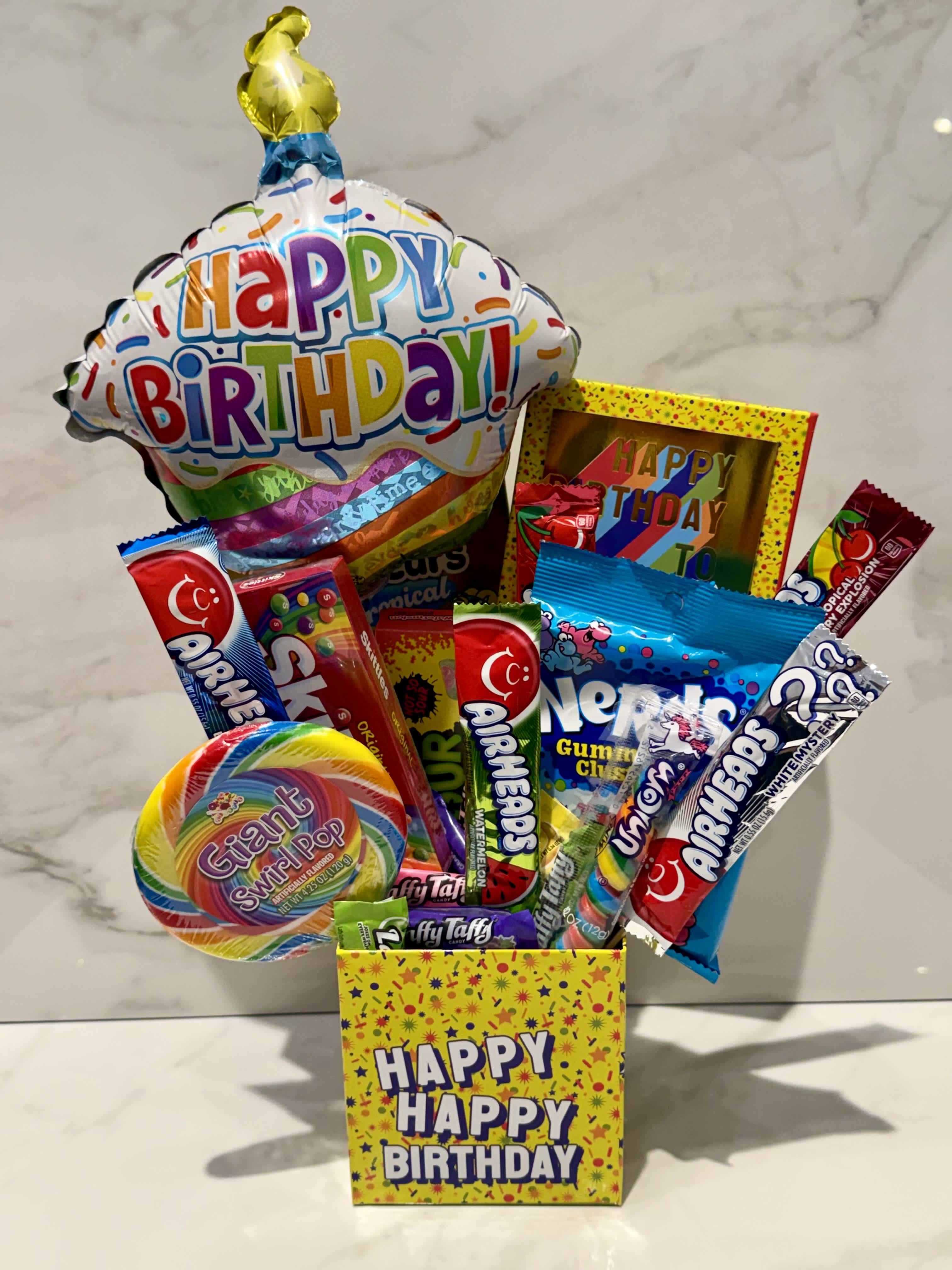 Birthday candy gift box with a balloon and assorted sweets