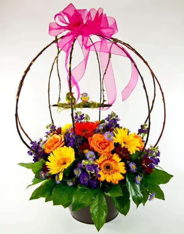Colorful flower basket with a pink ribbon bow and birdcage topper