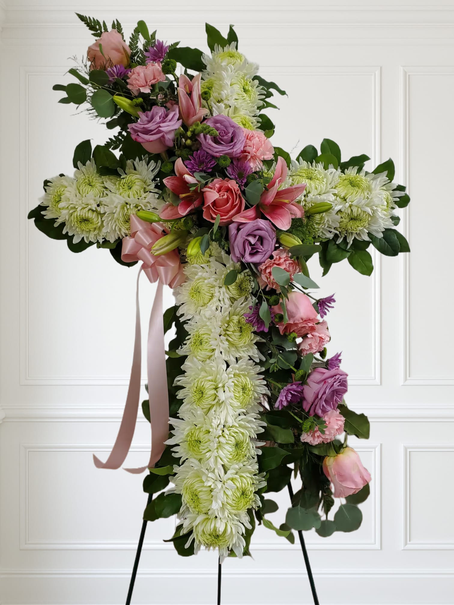 Soft color Cross by Manny - White cross with soft color flowers pinks and purples.