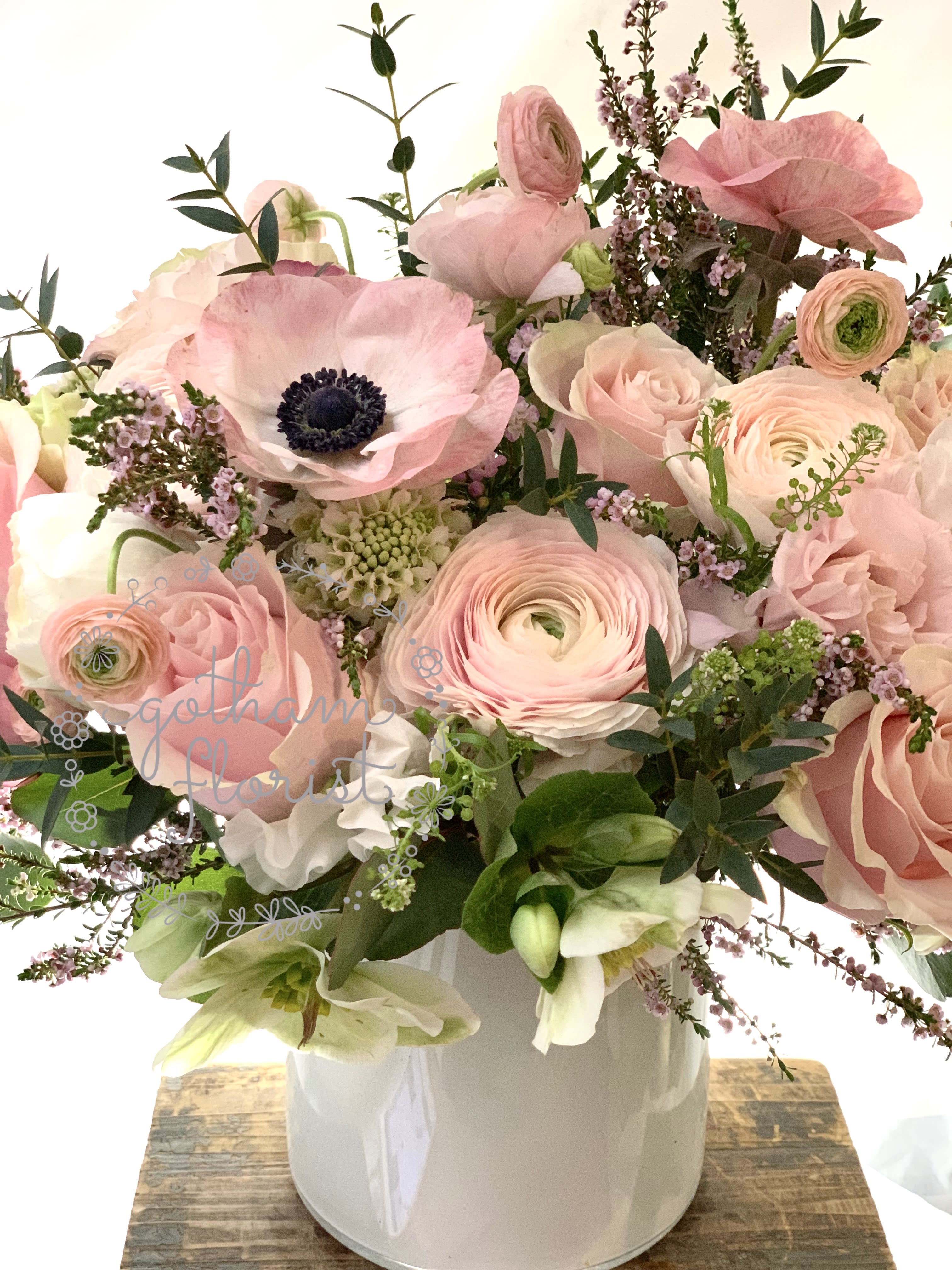 Pink and white mixed bouquet in a white vase