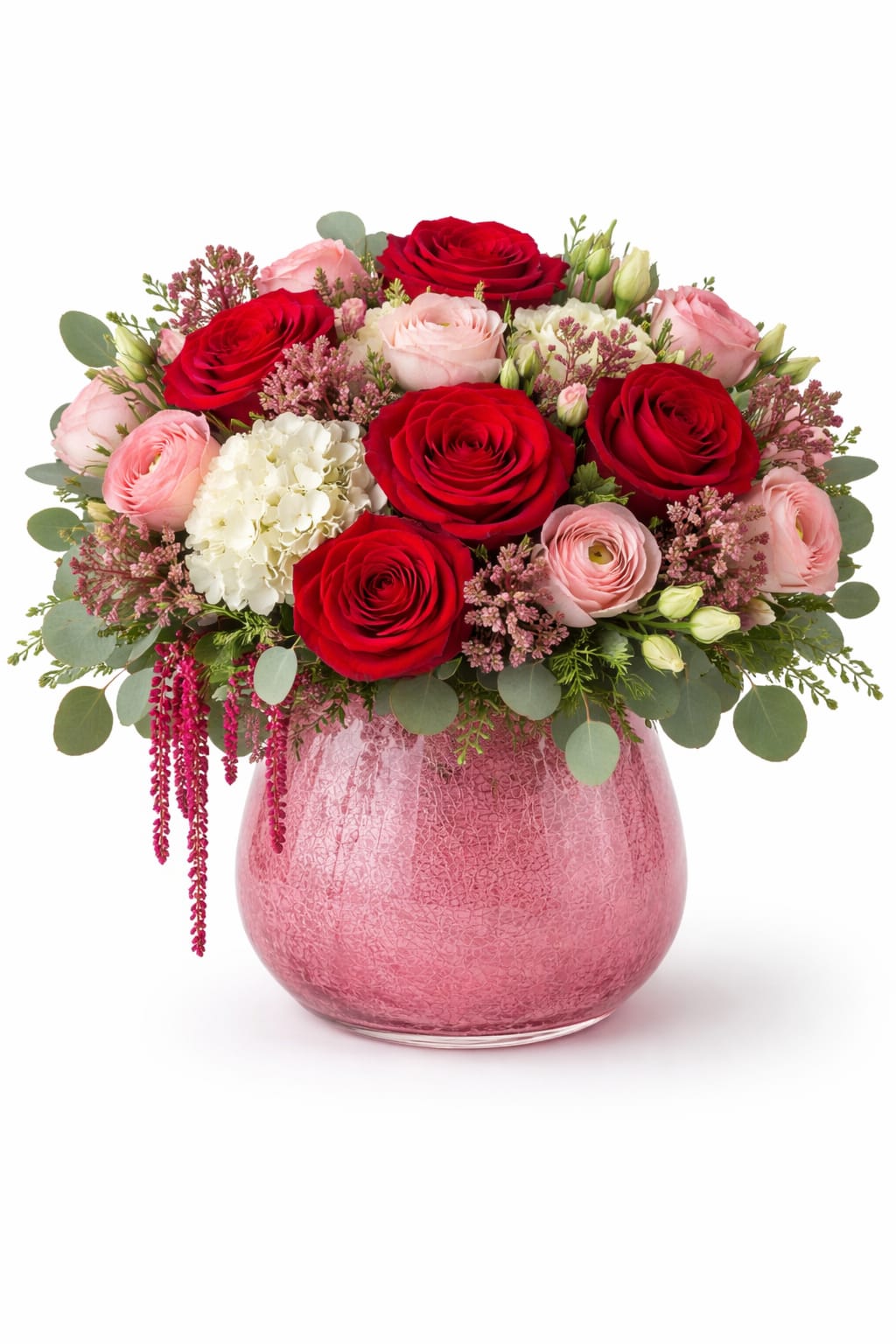 Pink and red rose bouquet in a pink glass vase