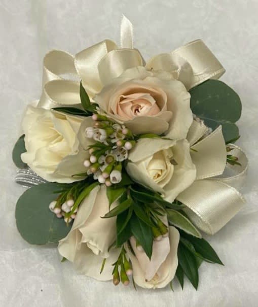 Cream rose bouquet with satin ribbon and greenery