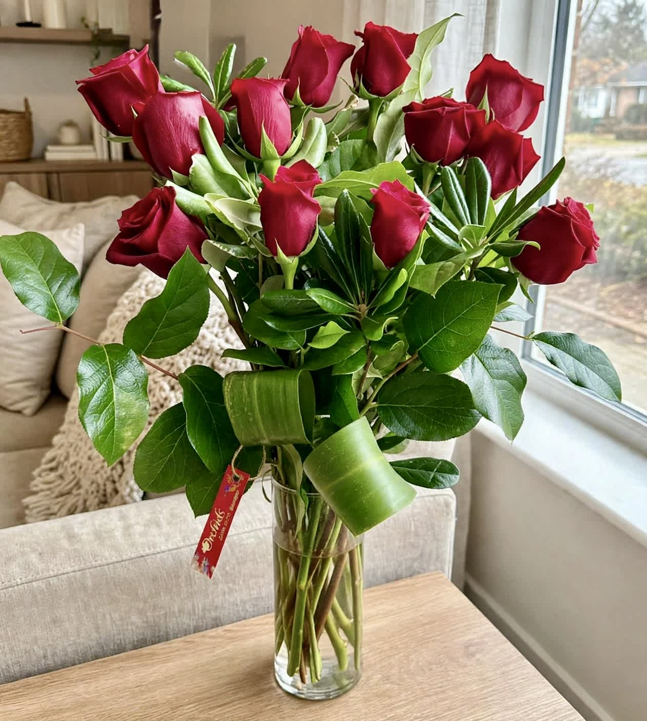 Bouquet of red roses in a clear glass vase