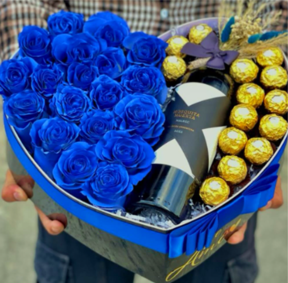 The "Sapphire King" Wine &amp; Rose Box  (20 Roses) - A spectacular, high-contrast luxury arrangement presented in a large heart-shaped box. One side is tightly packed with a stunning cluster of vibrant sapphire-blue roses, while the other side elegantly holds a premium bottle of Argentine Malbec wine, framed by a border of gold-wrapped Ferrero Rocher chocolates. Accented with a sleek blue ribbon and delicate dried botanicals, it is a bold and sophisticated statement gift perfect for Dad.