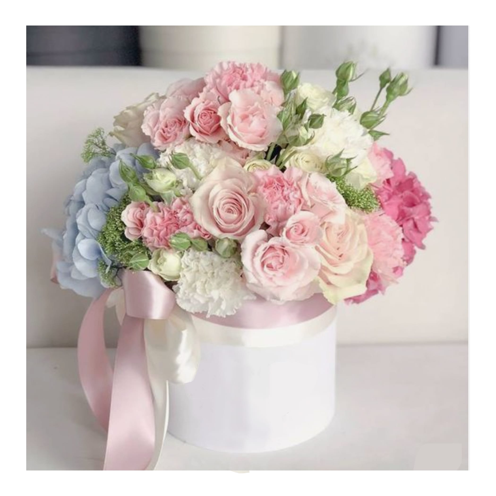 Mi Amore - variety of blooms arranged in a box.  Can be as picture, or a red heart theme for Valentines.  Just request color in comments.  We love making this one.