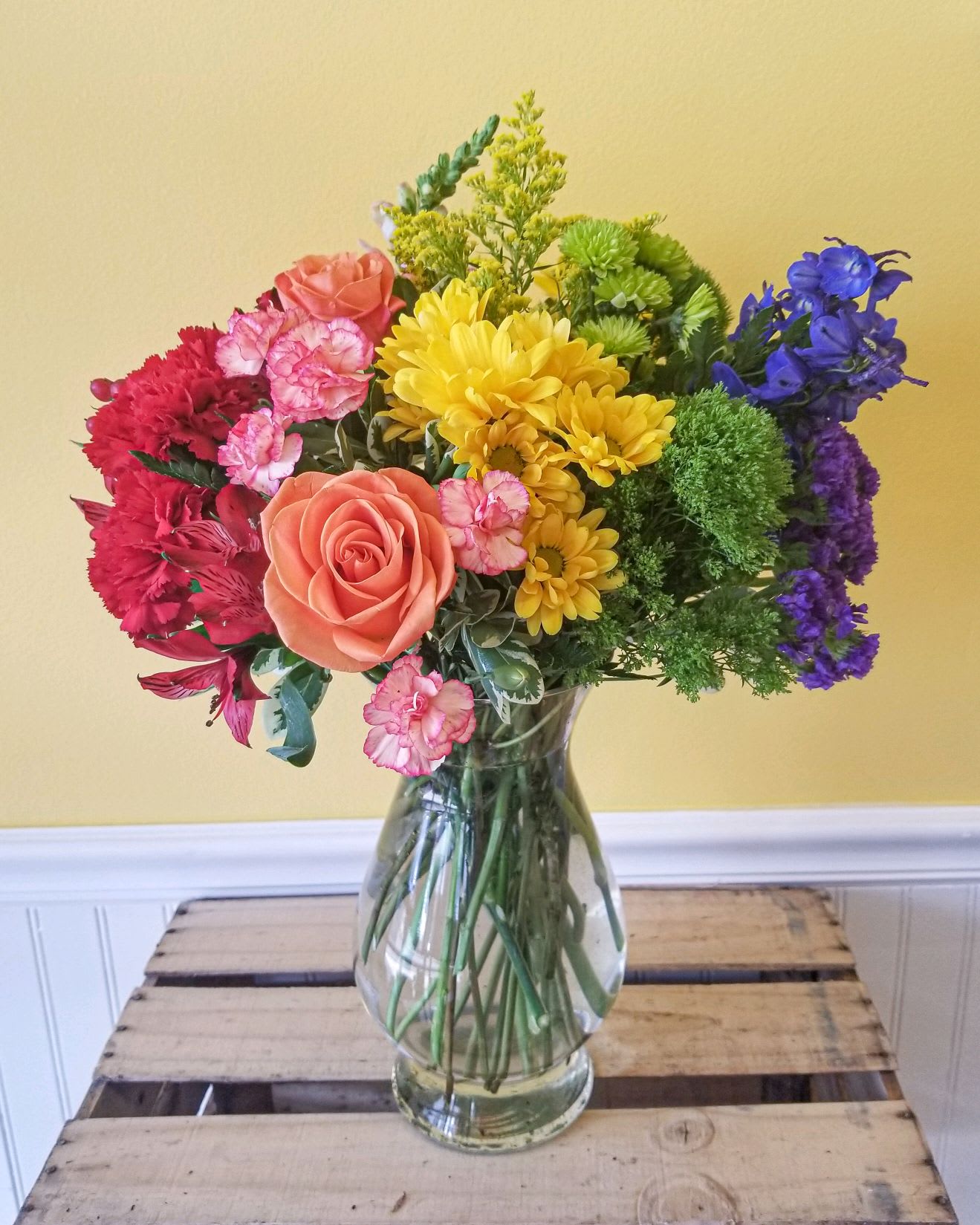 Colorful mixed bouquet in a clear glass vase
