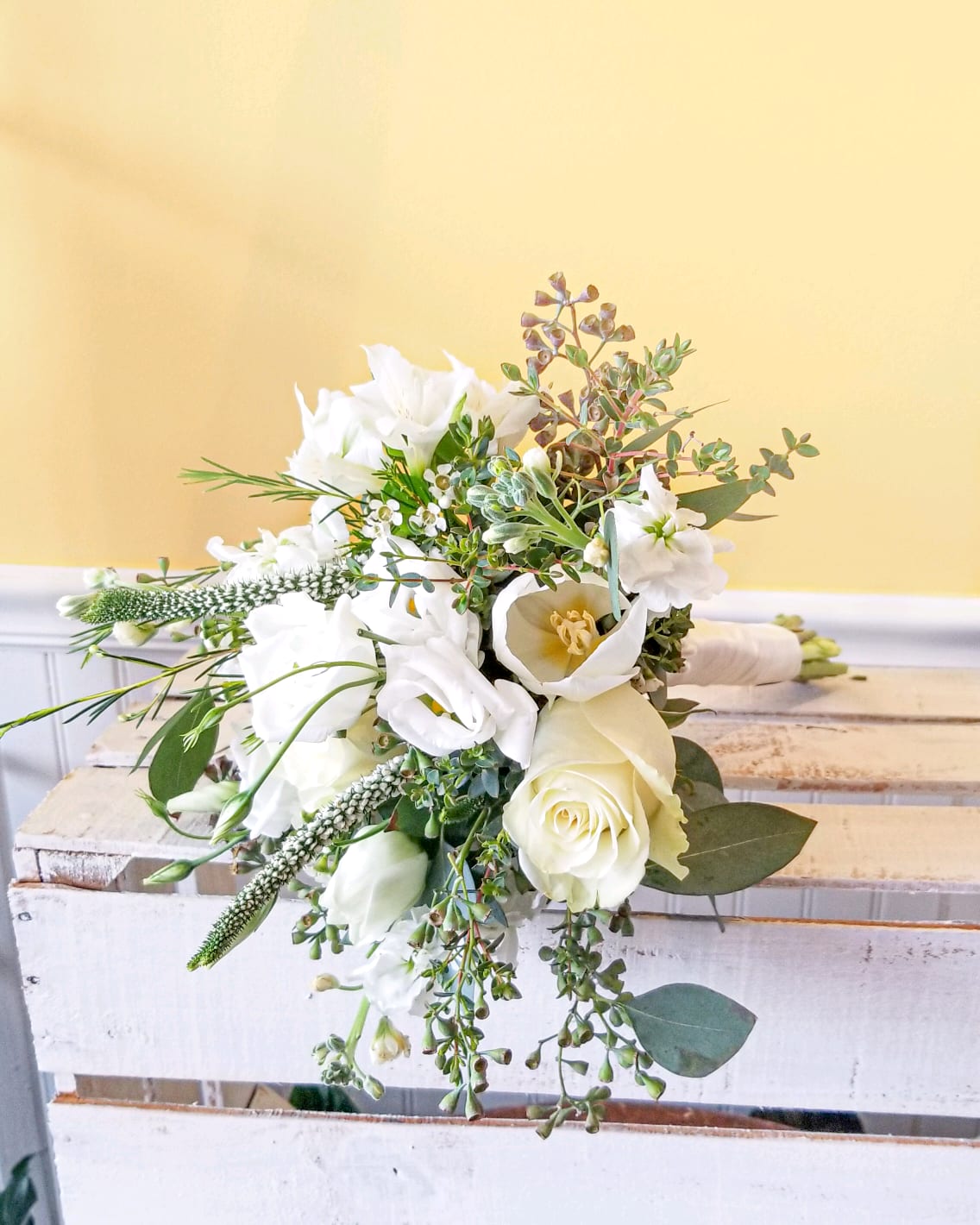 White floral bouquet with roses and lilies