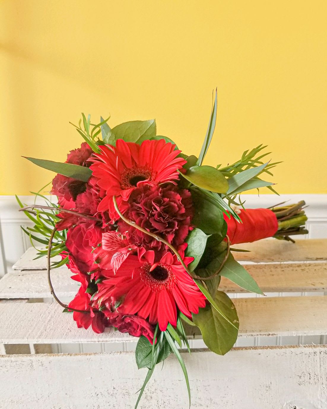 All Red mixed flower handheld Bouquet - Handheld red prom bouquet with mixed flowers. Actual Bouquets will vary with particular blooms so that they own individual signature. Picture is for example. *** If you would like to change any ribbon colors, please note in the Florist Instructions at checkout. We will contact you to confirm availability and pick up time *** ***All Prom orders are final - No changes or cancellations within 48 hours of event***