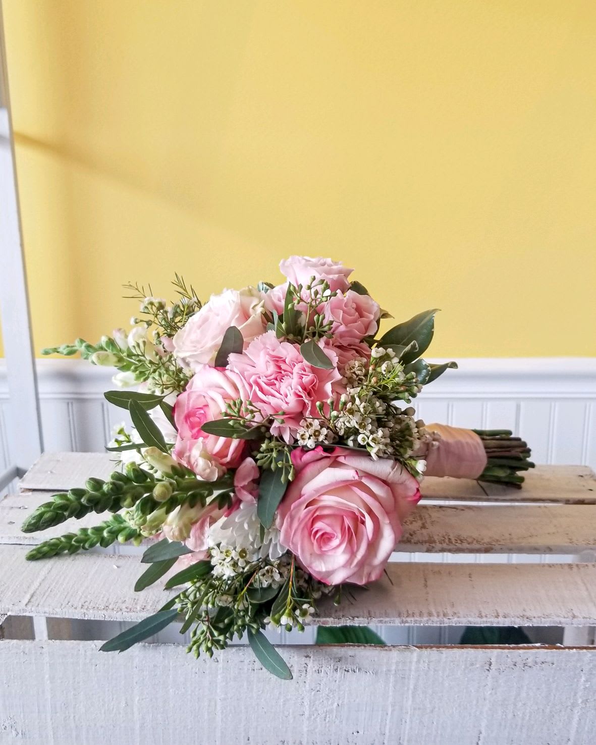 Pink rose bouquet with white filler flowers and greenery