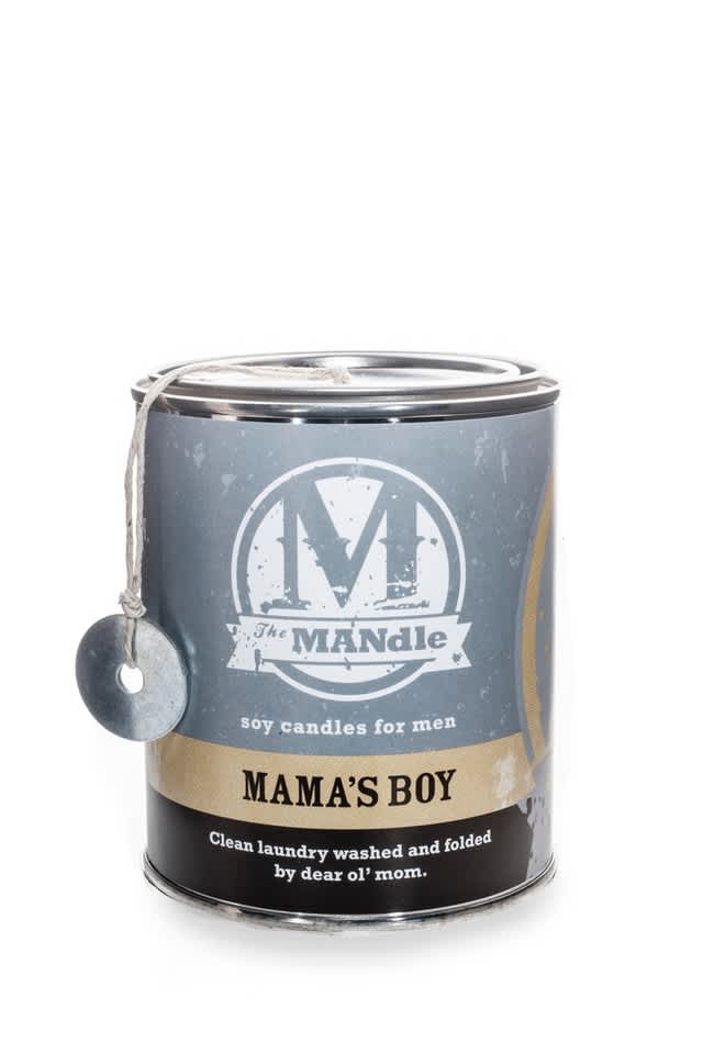 Labeled candle in a metal tin with a hanging tag