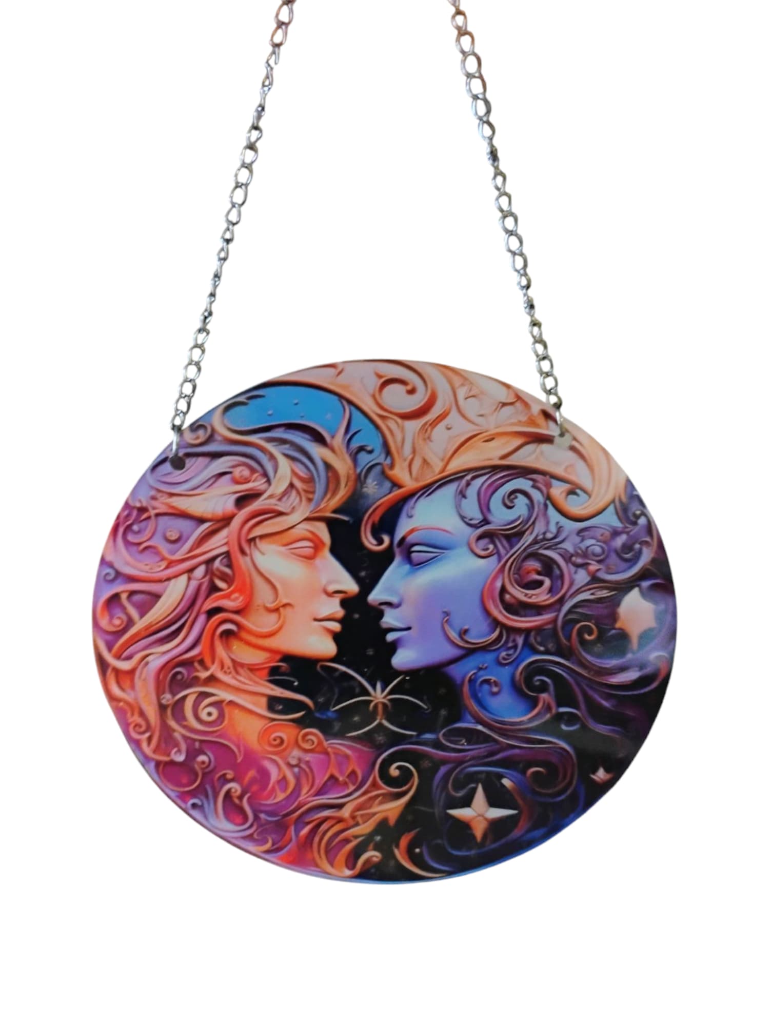 Round hanging plaque with two stylized faces in colorful swirls