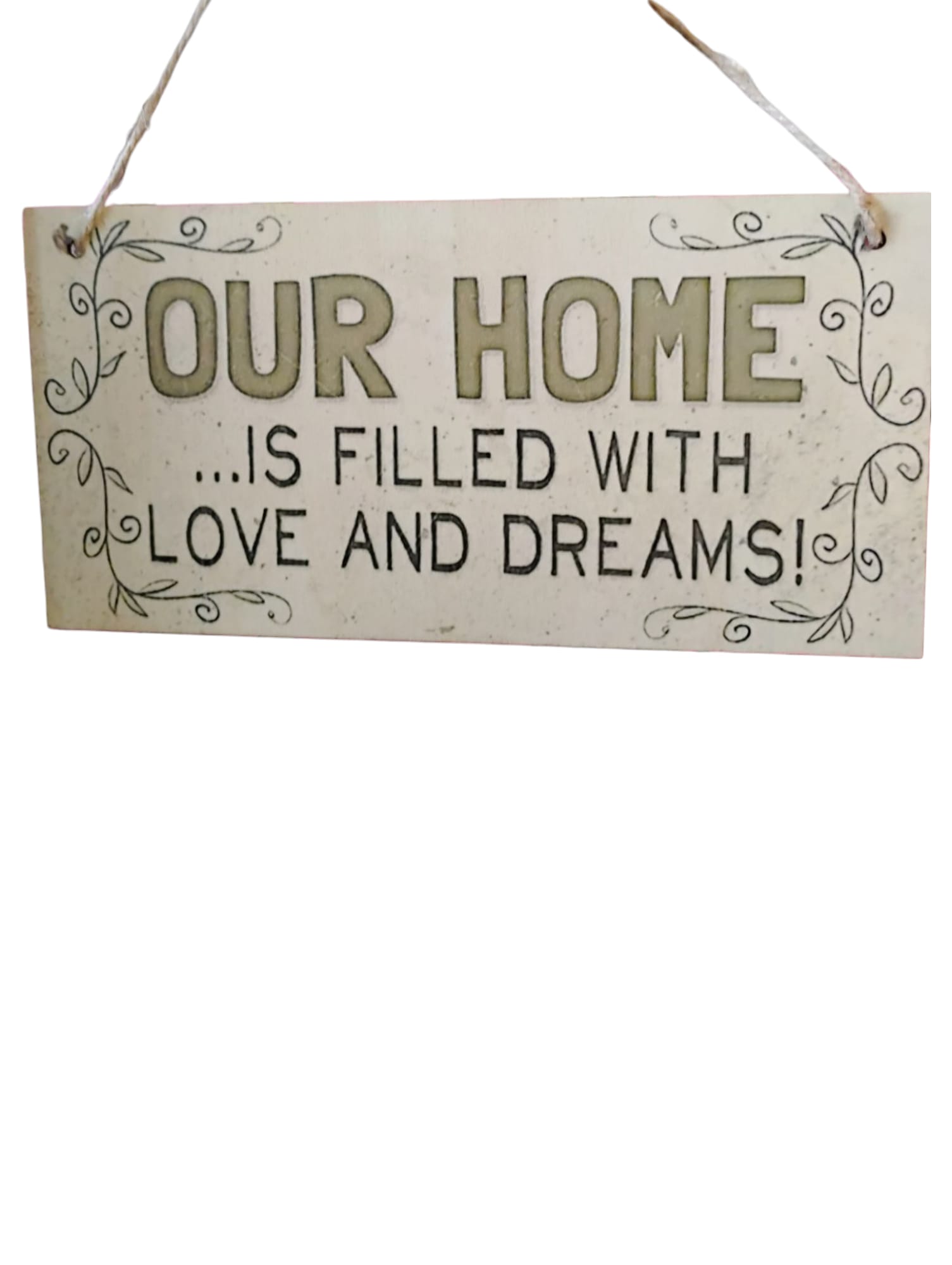 Hanging wooden sign reading "OUR HOME IS FILLED WITH LOVE AND DREAMS!"