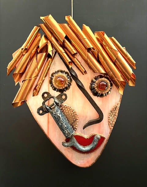 #A065 - Punk Rocker - A playful metal wall sculpture that reads like wearable art - this funky, unusual wall mask pairs well with punk-inspired mixed-metal components with warm floral tones to create a standout gift for art lovers and creators. Designed as a stylized human face, the piece makes a bold statement for birthdays, housewarmings, or as a unique anniversary accent: the rolled copper "hair" forms a bright sculptural crown while bold red lips and pale peach or pink face shapes deliver an immediate emotional pop that will make the person you're thinking of smile. Handmade details include curled copper “hair”, metal gears and hardware pieces, glass cabochons for eyes, and antique car parts. Colors range from orange, peach, red and pink highlights to black accents and feature copper or weathered metal pieces that add depth and a lightly industrial edge. The piece reads as both whimsical and tactile: shiny copper, matte painted faces, and glossy cabochon "eyes" combine for a mixed-media look that sparkles from across the room. Perfect for someone who collects quirky decor or for a creative studio wall, this sculpture is an unexpected way to celebrate milestones without the usual bouquet-think a meaningful gift that feels personal and seen.   Shipping available - select Delivery, then message us to ship.