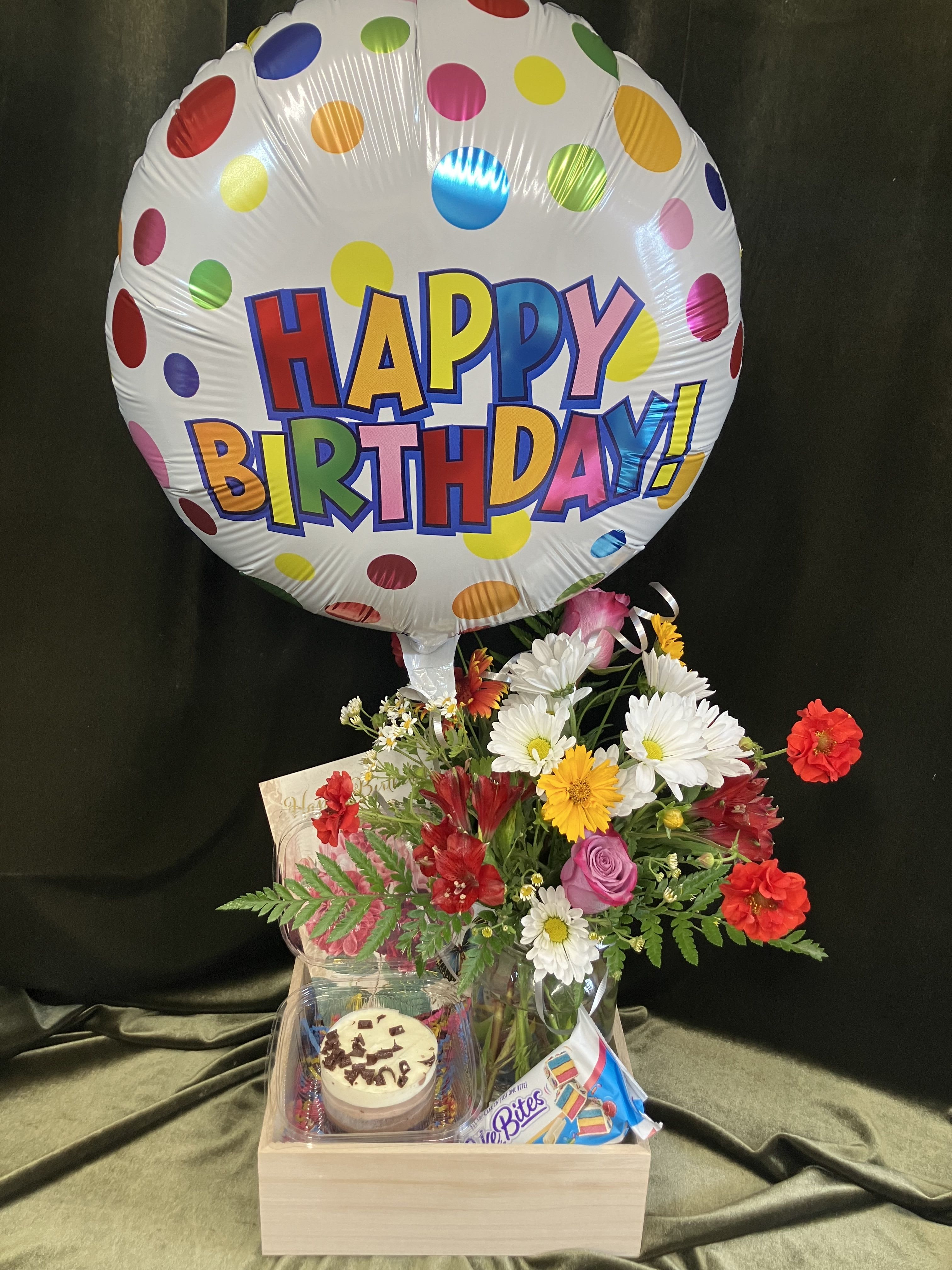 Birthday Party in a Box - Specifically designed for a mini birthday party, sweet treats, flowers and a happy birthday mylar balloon in a box! Items included in the box are cakeBites, chocolate mouse cake, a full size birthday card and a colorful fresh flower arrangement in a mason jar and mylar balloon. Send a special birthday gift to let them know you are celebrating with them in spirit!