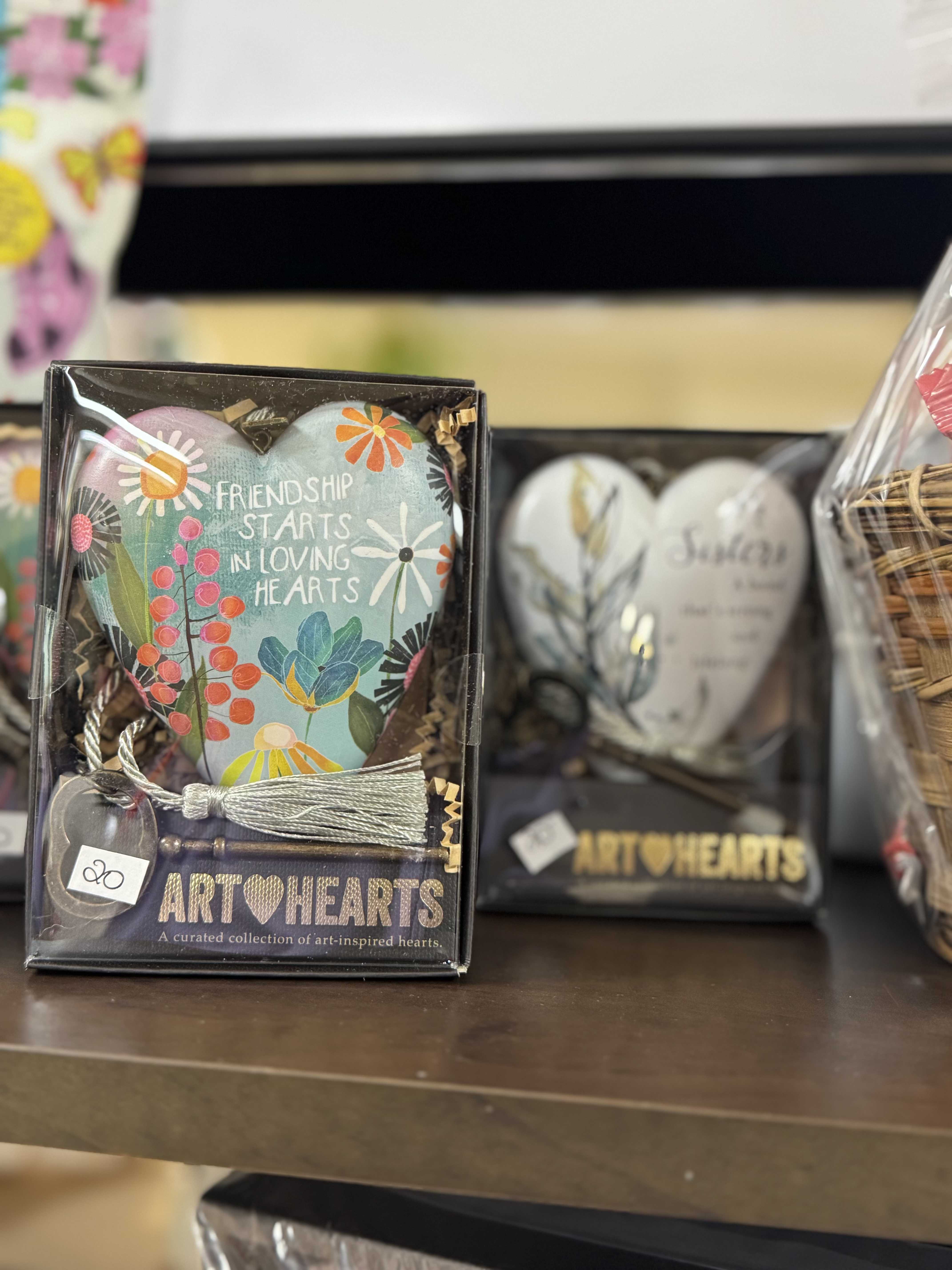 Gift box with a painted heart ornament and tassel