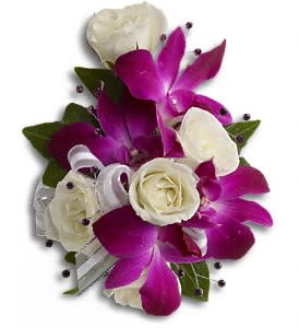 Fancy Orchids and Roses Wristlet - Fabulous fuchsia and white blooms with the subtle sparkle of rhinestones.  A fantastic contrast of purple dendrobium orchids with white spray roses on a pearl wristlet.  Approximately 5" W x 6 1/4" H