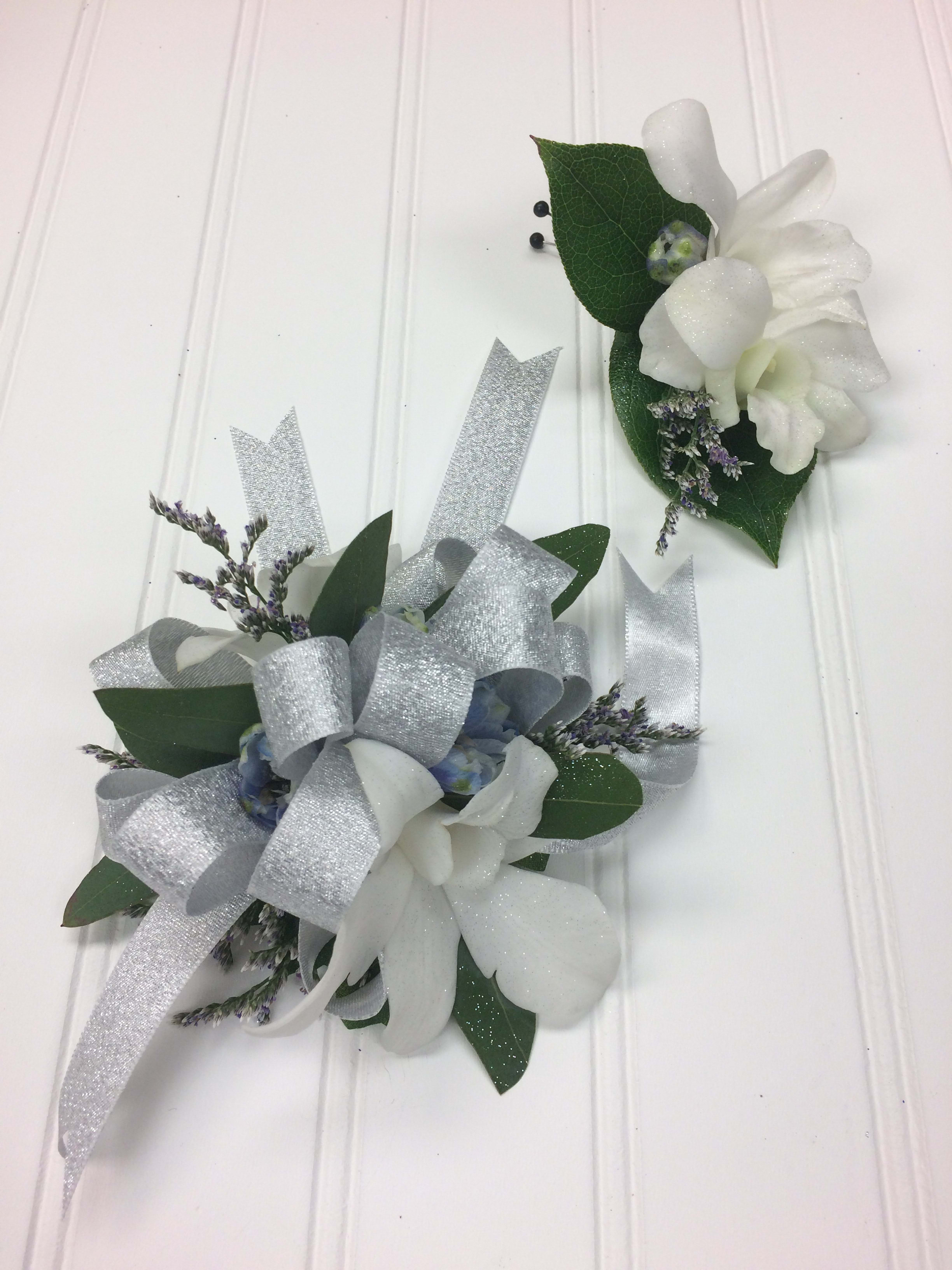 White Swan Corsage &amp; Boutonniere - White Dendrobium Orchids accented with light blue delphinium makes this the perfect accent to any prom dress!