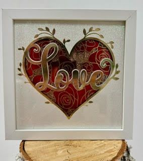 Framed heart artwork with the word Love in the center