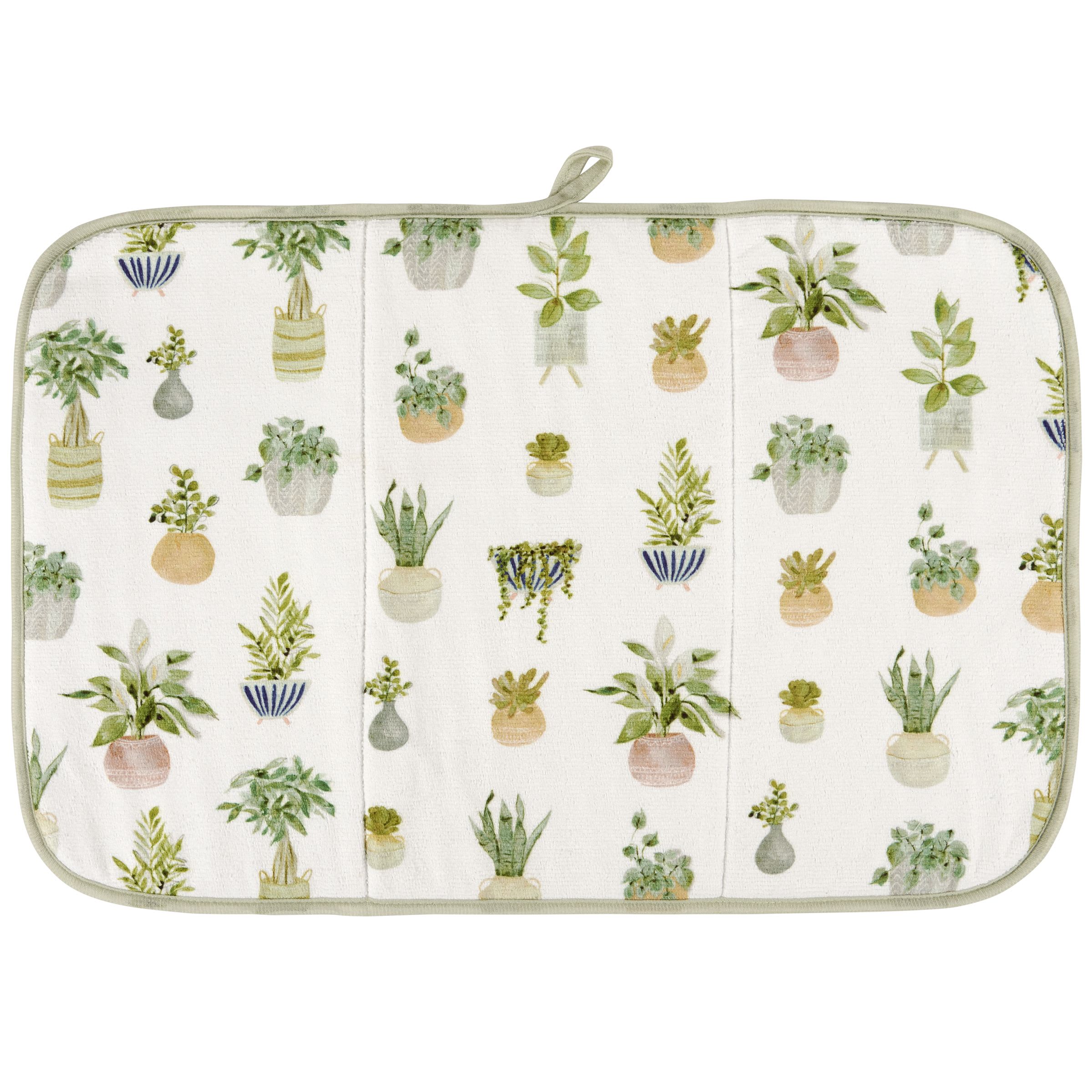 Plant Drying Mat - An ultra-absorbent drying mat displaying a plant inspired pattern of house plants and succulents. House plants designs are replicated from original artwork hand painted in a unique watercolor style. Plants drying mat features a full color design on the 21 inch by 14 inch space to place items to dry with coordinating green color on the back and trim. Our Plants drying mat includes a hanger at the top to display design or to air dry when not in use. Drying mat is conveniently machine-washable for easy cleaning and folds up for easy storage. A stylish plant-themed kitchen accessory perfect for everyday use.
