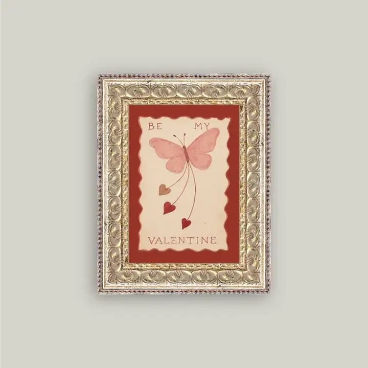 Framed Valentine card with a pink butterfly and hearts