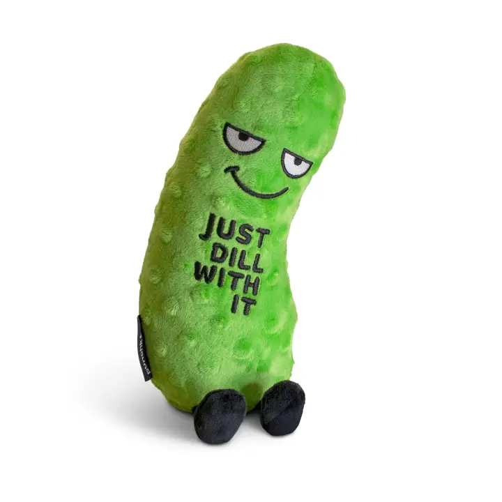 Green pickle-shaped plush toy with a face and text