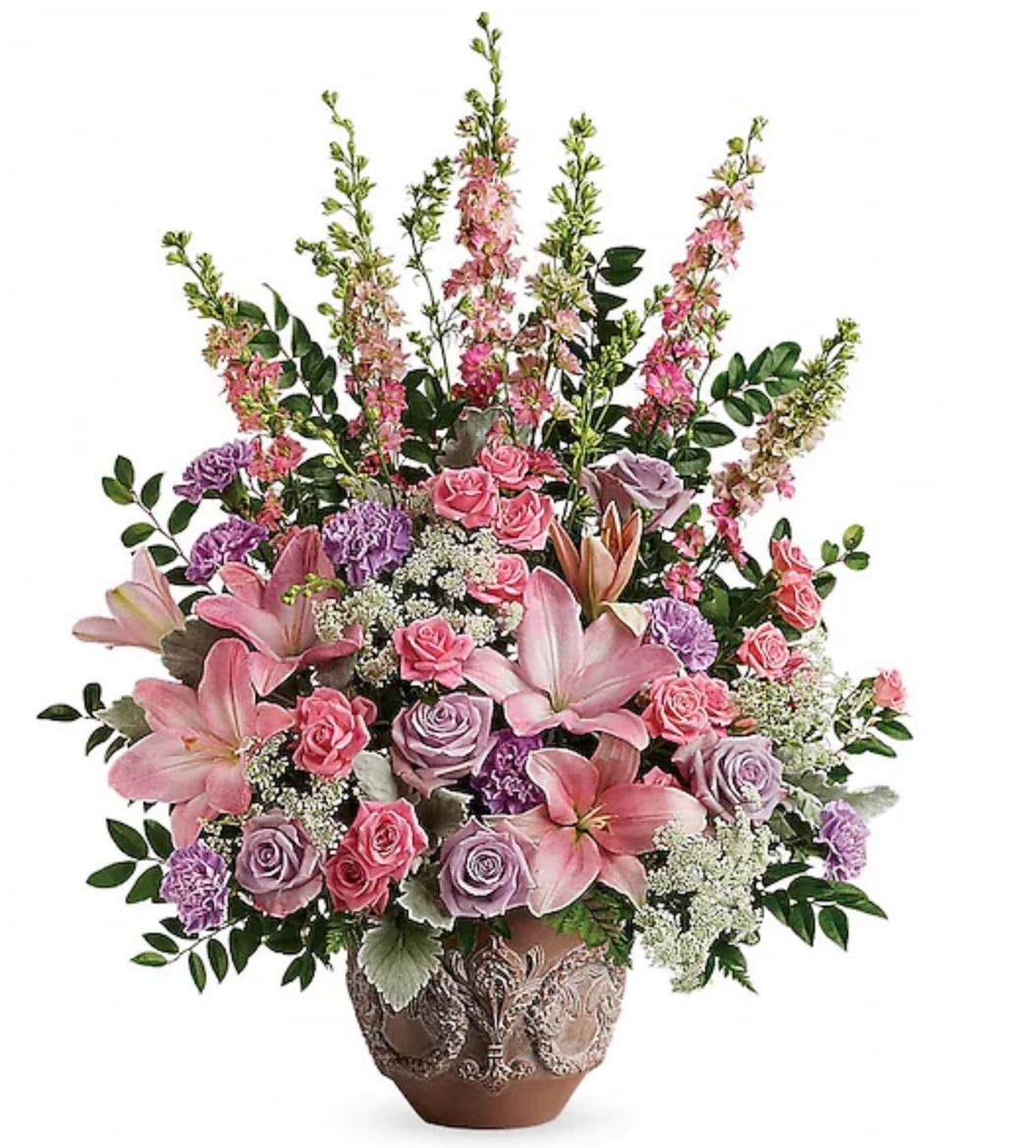 Pink and lavender floral arrangement in a decorative vase