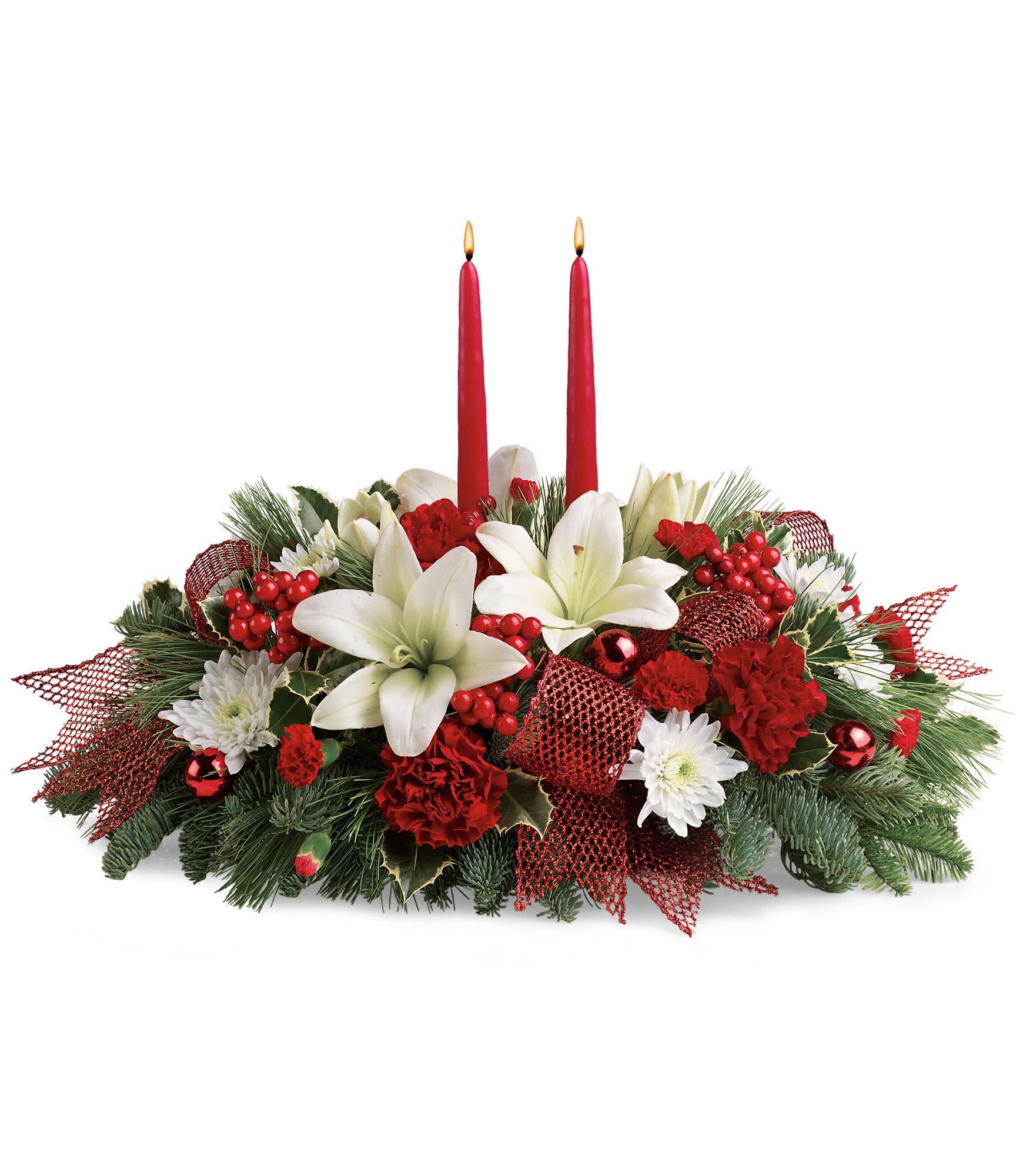 Yuletide Magic Centerpiece - White asiatic lilies, red carnations, red miniature carnations and white cushion spray chrysanthemums are accented with noble fir, white pine, variegated holly, berries and festive red ribbon. Approximately 21 1/2" W x 15" H.  TWR12-3A