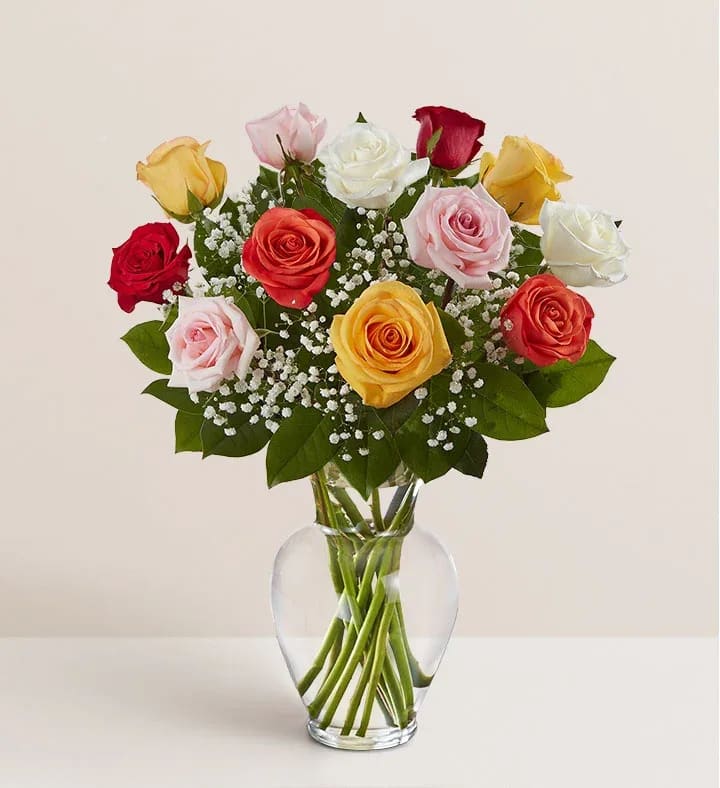 Mixed roses in a clear glass vase